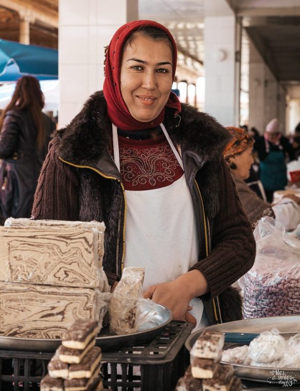 lady in bazaar selling halva in Samarkand